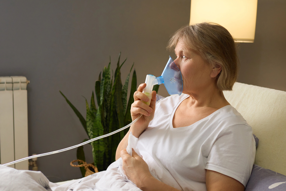 Patient performing spirometry lung test at primary care office near Polk City Florida