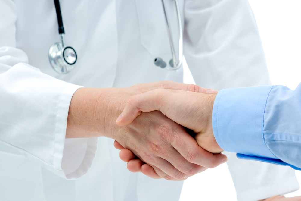 A man shaking hands with his doctor