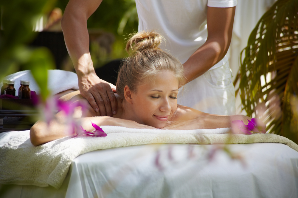 A woman is getting a massage at a spa